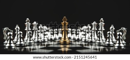 Close-up king chess standing on chessboard concepts of leader teamwork or volunteer or challenge of business team or wining and leadership strategy and organization risk management or team player.