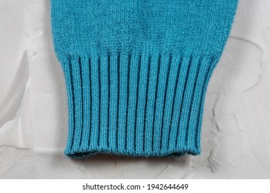 Close-up Of Knitted Elastic Blue Sweater Cuff.