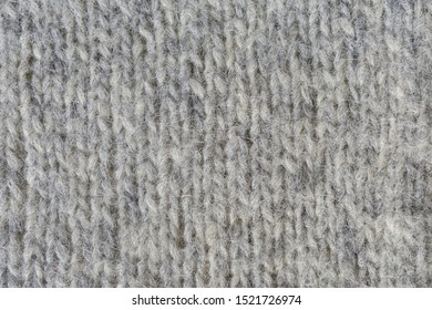 Close-up Of Knitted Gray Woolen Texture. 