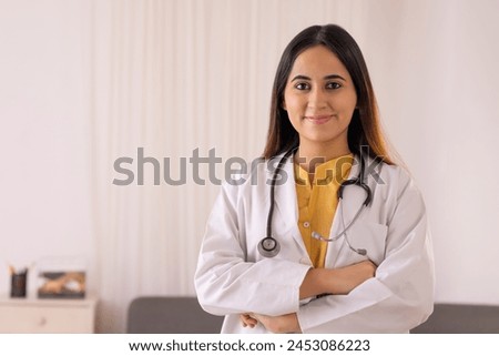 Close-up of a lady doctor with folding arms