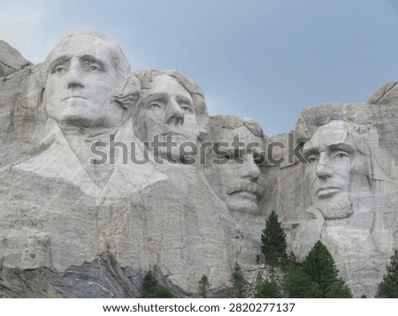 Closeup Landscape View of Mount Rushmore under Dark Gray Clouds of Stormy Sky