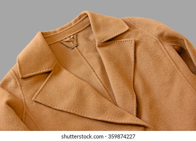 Close-up Of Lapel Of Wool Coat On Gray Background.