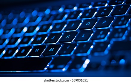 Closeup of laptop keyboard illumination, backlit keyboard - Shutterstock ID 559031851