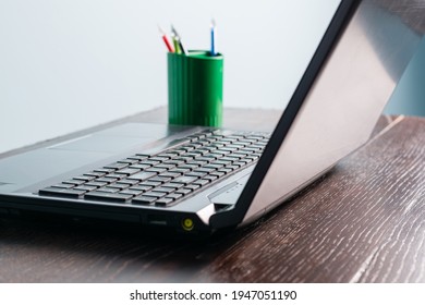 Close-up Laptop On A Wooden Table. Office Desk With Laptop, No People.