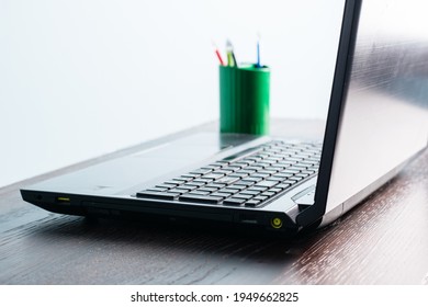 Close-up Laptop On A Wooden Table. Office Desk With Laptop, No People.