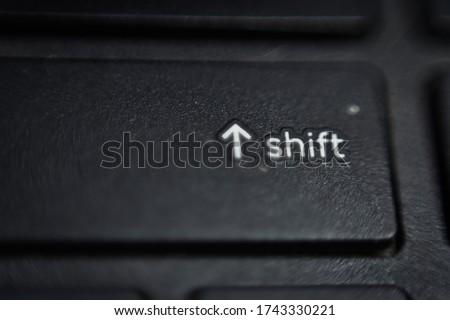 closeup of a laptop shift key with shallow depth of field, shift key 