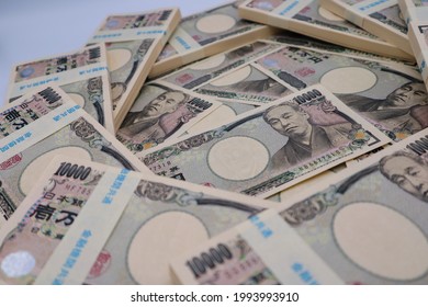 Close-up Of A Large Amount Of Japanese Wads.
Translation:Japanese Silver,
10,000,Common To All Institutions,
Financial Institution,Japanese Silver,10,000,Japanese Silver,Yukichi Fukuzawa.
