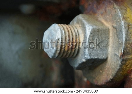 Close-up of a large bolt with nut 