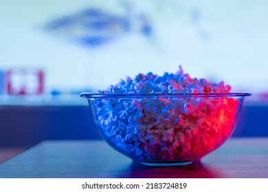 Close-up. A Large Bowl Of Popcorn In Front Of A Plasma TV Screen. Cozy Relaxation In Front Of The TV, Watching Your Favorite Movies, Series, Sports And Music Programs, Fast Food.