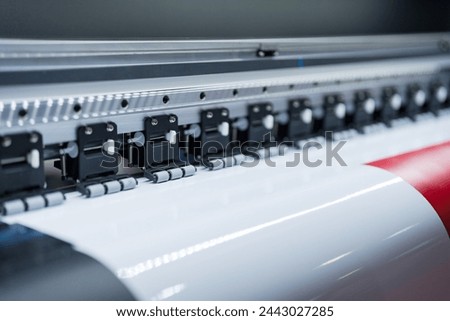 Close-up of large format printer heads in action, Detailed view of modern large format printer heads working on white media