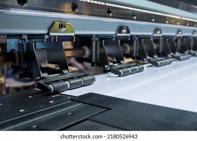 Closeup Of A Large Format Tarpaulin Printer, Showing The Anti-static Pinch Rollers And Mute Guide Rail.