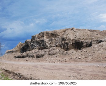 Close-up of large heap of rock stone quarry mining resources.
