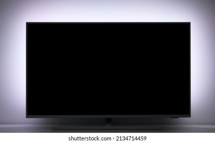 Close-up Of A Large LED TV With Backlight.TV Set In A Cozy Living Room.  