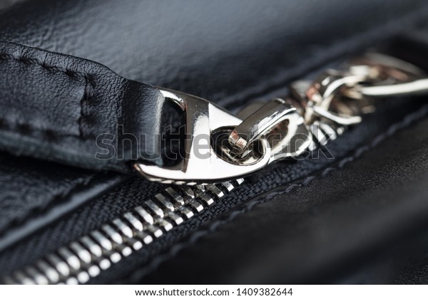 Close-up of leather products zipper opening.\
Leather goods.