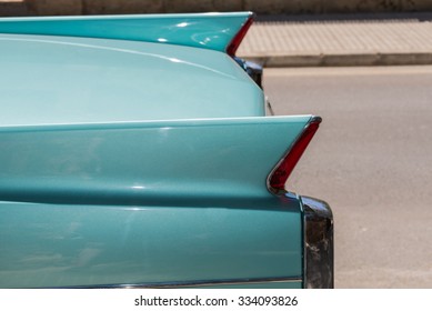 Closeup Of Legendary Classic Car In Retro Turquoise Color. 
Vintage Automobile American 50s Style, Extravagant Tail Lights