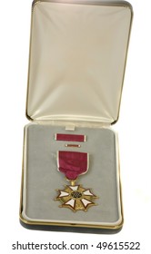 Closeup Of The Legion Of Merit Medal, The Sixth Highest US Military Award --  The Medallion, Ribbon, And Lapel Pin In The Award Presentation Case.