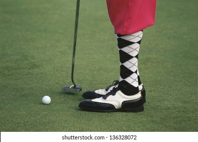 Close-up of the legs of a golfer