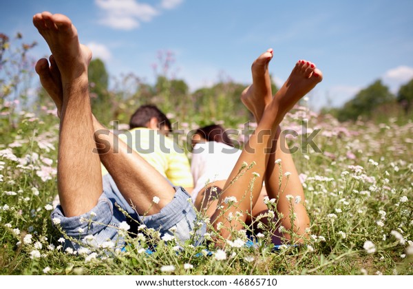 Close-up of legs of lying pair