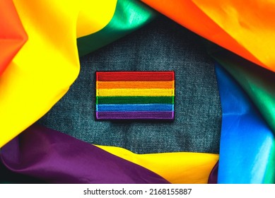 Close-up Of LGTBI Flag Textile Patch On A Denim Jacket And LGTBI Flag. Pride Day Concept