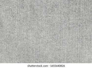 Closeup of light gray wool fabric texture for background
