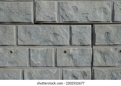 Closeup Of Light Grey Unpainted Brick Veneer Wall