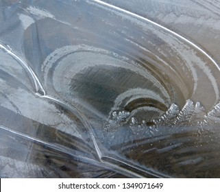 A Close-up Of Lines And Textures On A Frozen Puddle. The Forms Witness The Creativity Of Nature. All Gone Two Hours Later. A Spring Morning In Whitehorse, March 24, 2019.