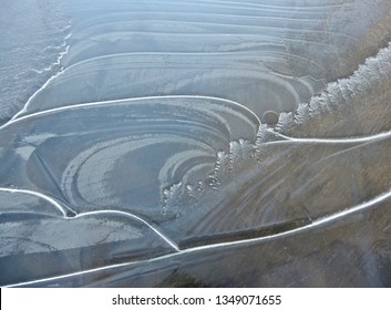 A Close-up Of Lines And Textures On A Frozen Puddle. The Forms Witness The Creativity Of Nature. All Gone Two Hours Later. A Spring Morning In Whitehorse, March 24, 2019.