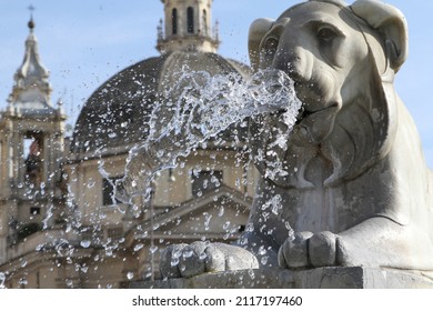 A closeup of a lion fountain on Piazza del Popolo in Rome, italy - Shutterstock ID 2117197460