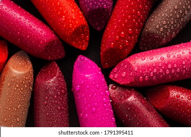 Closeup of lipsticks with water droplets