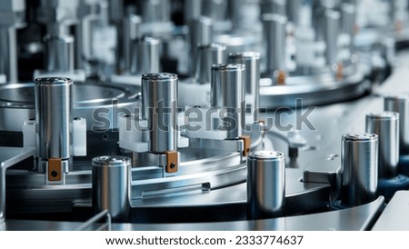 Close-up of Lithium-ion Cells for High-voltage Electric Vehicle Batteries Manufacturing Process. Battery Cells for Automotive Industry on Production Line. High Capacity Battery on Conveyor.