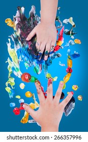 Closeup Of Little Children Hands Doing Finger Painting With Various Colors On Blue Background, Art Education And Creativity Concept, Top View