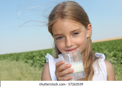 Closeup Of Little Girl Drinking Milk