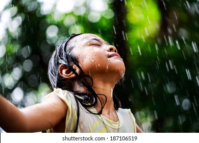 Closeup Little Girl In The Summer Rain