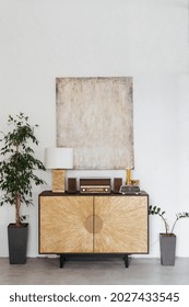 Closeup Of Living Room Interior With Vintage Decor. Modern Minimalistic Apartment Design, Wooden Decoration Of Drawer, Lamp. Nobody At Scandinavian Style House With Retro Radio, Clock.