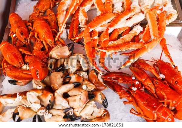 Closeup of lobsters, crabs and king crabs in\
Bergen fish market,\
Norway