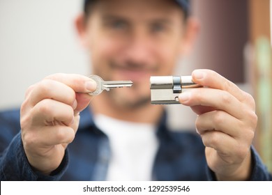 closeup locksmith fix a wood lock