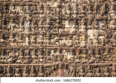 A closeup of long rows of mythical creatures called 'apsara,' Khmer angels, carved in the famous Elephant Terrace, a UNESCO World Heritage Site in Siem Reap, Cambodia.