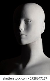 Closeup In Low Angle Shot To A White Female Manikin With Black Background. Arts, Anatomy And Photography Concept