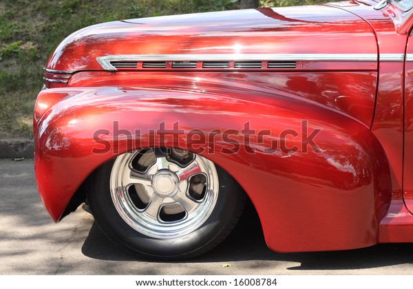 Closeup of\
a Low-rider custom Hot Rod Wheel and\
Fender