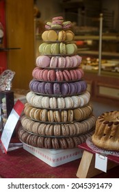 Closeup of macarons forming a pyramid in the bakery showroom