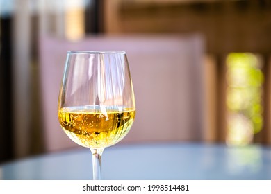 Closeup Macro Of Alcohol Hard Cider With Yellow Color Drink And Carbonated Bubbles As Sparkling Wine In Glass From Cidery In Virginia