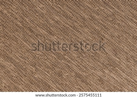 Closeup, macro of brown fabric texture background. Satin diagonal weaving cloth structure, canvas. Textile for decor, upholstery, garment. Wallpaper, backdrop.