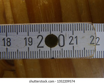 Closeup (macro) Of A Folding Meter Stick (pocket Rule, Folding Metre Stick) From 18 To 22 Centimeters