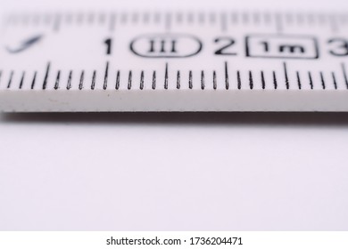 Closeup macro of a folding rule. Scale for measuring distance. Concept for craft or progress. Financial or scientific development. Handicraft activity