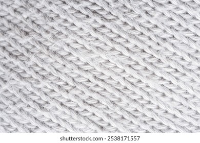 Close-up macro of gray sweater fabric fibers,Macro texture of woolen brown crocheted sweater as background, close-up of beige crocheted front surface, woolen texture of woolen wool, crocheted - Powered by Shutterstock