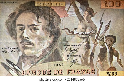 A Close-up Macro Photo Of 1982 French Banknote Of 100 Francs. The Banknote Features A Portrait Of The Painter Eugène Delacroix And A Reproduction Of His Painting 