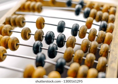 Close-up Macro Photo Of Vintage Abacus For Calculation.