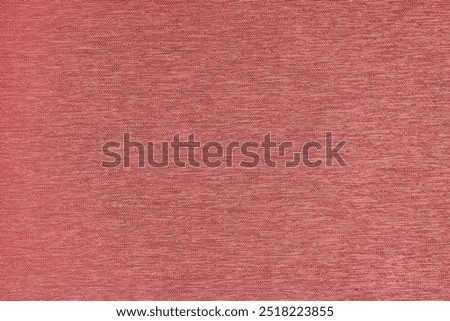 Closeup, macro of red fabric texture background. Satin weaving cloth structure, canvas. Textile for decor, upholstery, garment. Wallpaper, backdrop.