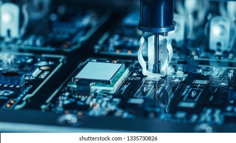 Close-up Macro Shot of Electronic Factory Machine at Work: Printed Circuit Board Being Assembled with Automated Robotic Arm, Place Technology Mounts Microchips to the Motherboard