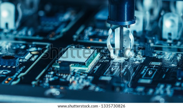 Close-up Macro Shot\
of Electronic Factory Machine at Work: Printed Circuit Board Being\
Assembled with Automated Robotic Arm, Place Technology Mounts\
Microchips to the\
Motherboard
